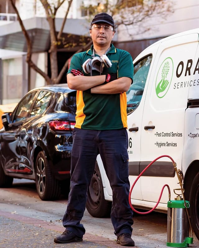 oracle pest control technician outside van